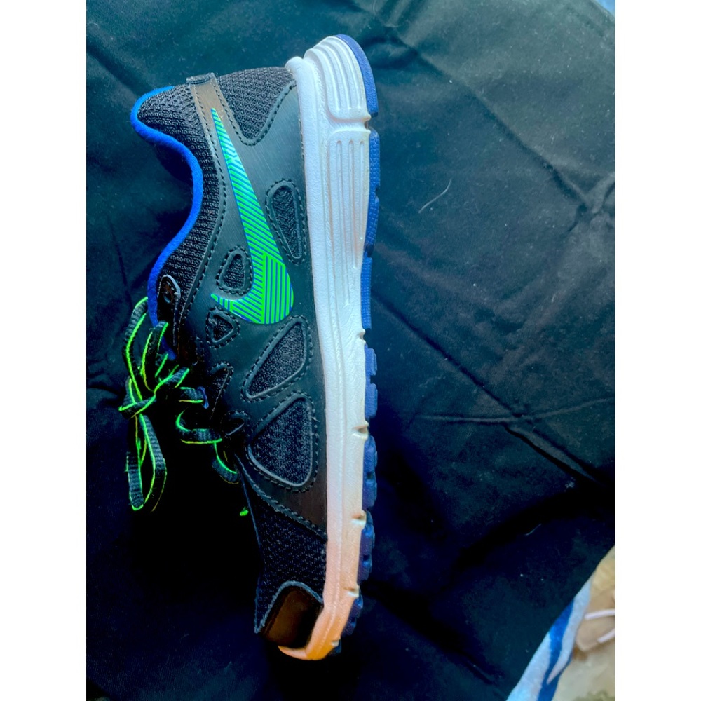 Worn only 3 times. Black and royal blue tennis shoes with lime green accents